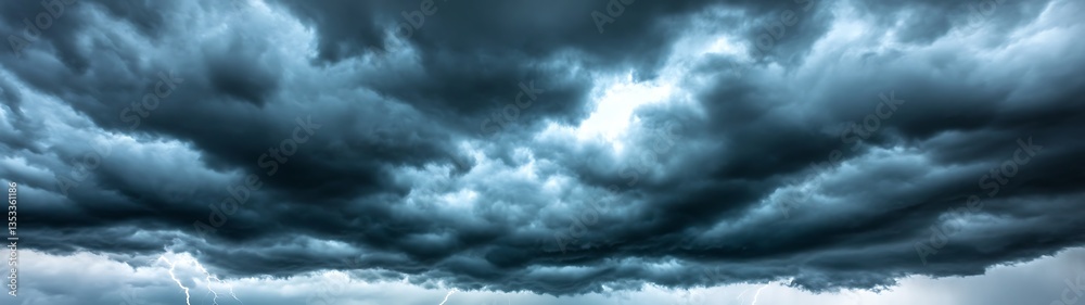 Dark and menacing storm clouds dominate the dramatic sky above