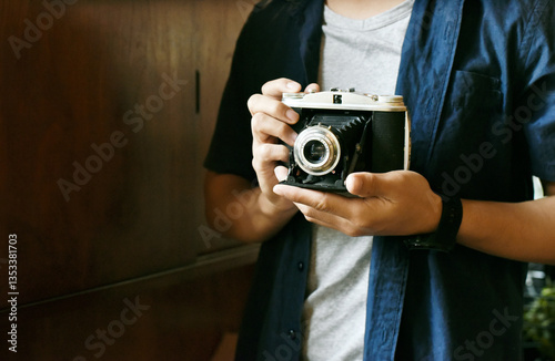 photographer hold vintage camera