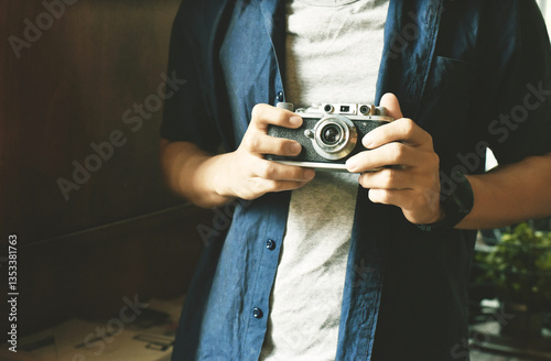 photographer hold vintage camera