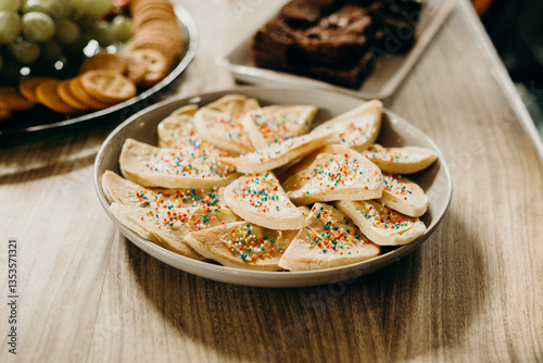Horizontal shot of a bowl of pikelets sprinkled with colorful hundreds and thousands