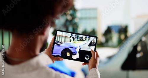 Insurance adjuster documenting car damages for accident claim