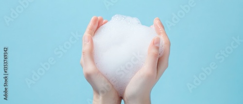 Hands holding white foam