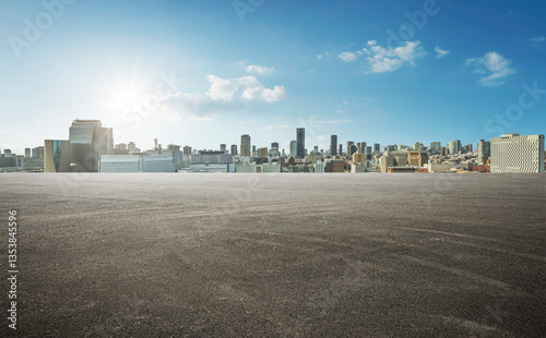 Fototapeta Naklejka Na Ścianę i Meble -  Panoramic empty wide asphalt road and modern city skyline under the sunlight.