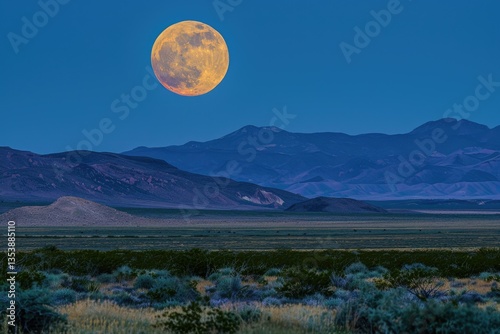 Vibrant Color Picture of Full Moon Rising Over Desert Landscape