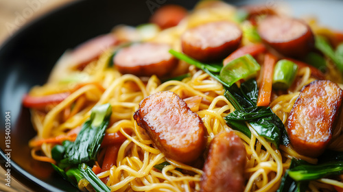 Food photography of stir-fried noodles with sausages and vegetables