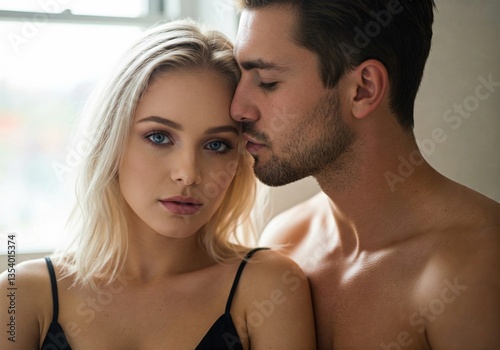 A passionate couple in an intimate moment. A handsome shirtless man whispers closely to a beautiful blonde woman with blue eyes, while she looks at the camera. Romantic, sensual, and emotional scene.
