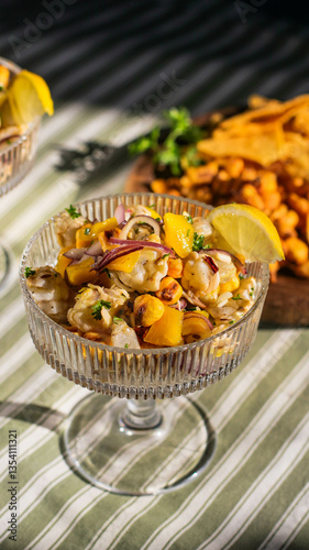 cocktail salad in bowls from seafood with lemon close-up