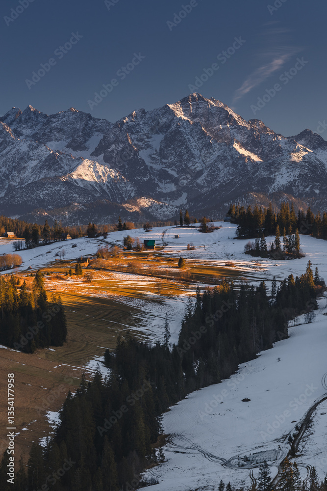 Views from Podhale towards the Tatra Mountains. This winter, there was less snow than usual, revealing more of the rugged landscape. A mix of winter and autumn colors creates a unique seasonal contras