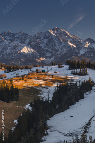Obraz na płótnie Views from Podhale towards the Tatra Mountains. This winter, there was less snow than usual, revealing more of the rugged landscape. A mix of winter and autumn colors creates a unique seasonal contras w salonie