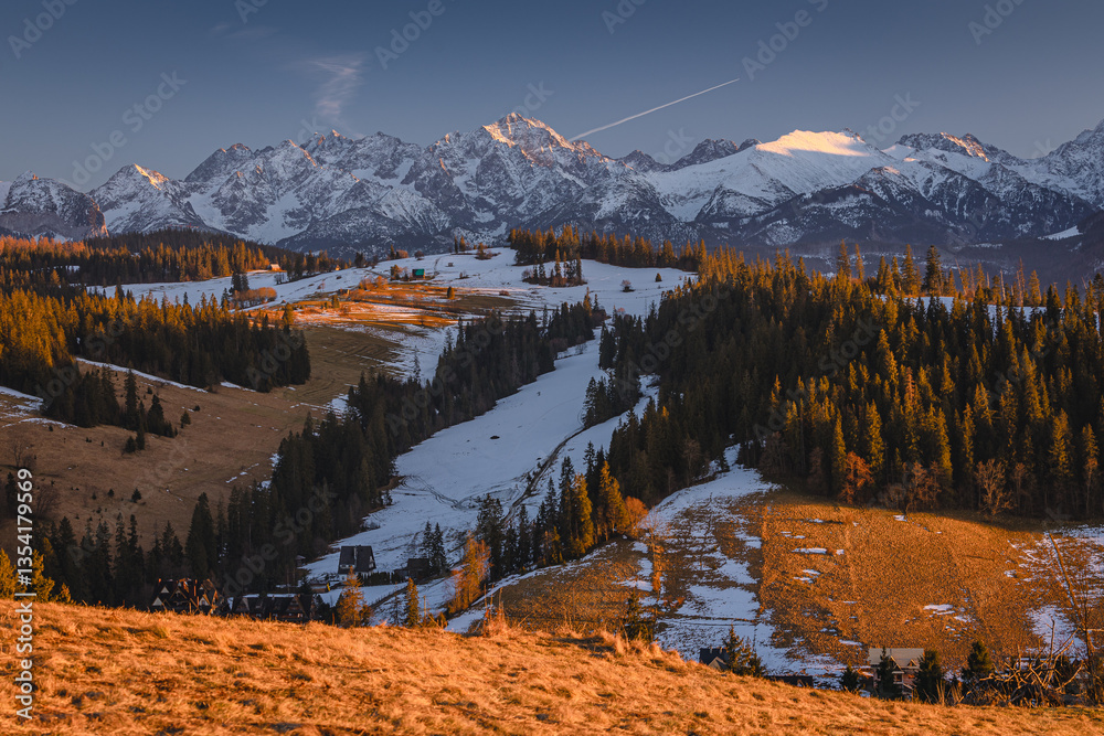 Views from Podhale towards the Tatra Mountains. This winter, there was less snow than usual, revealing more of the rugged landscape. A mix of winter and autumn colors creates a unique seasonal contras