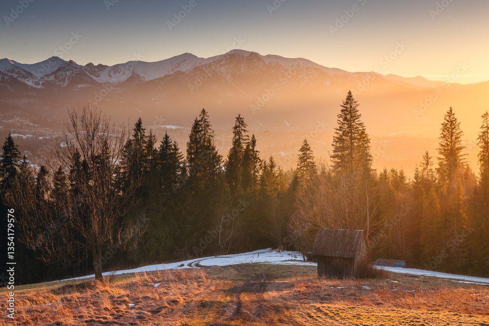 Views from Podhale towards the Tatra Mountains. This winter, there was less snow than usual, revealing more of the rugged landscape. A mix of winter and autumn colors creates a unique seasonal contras