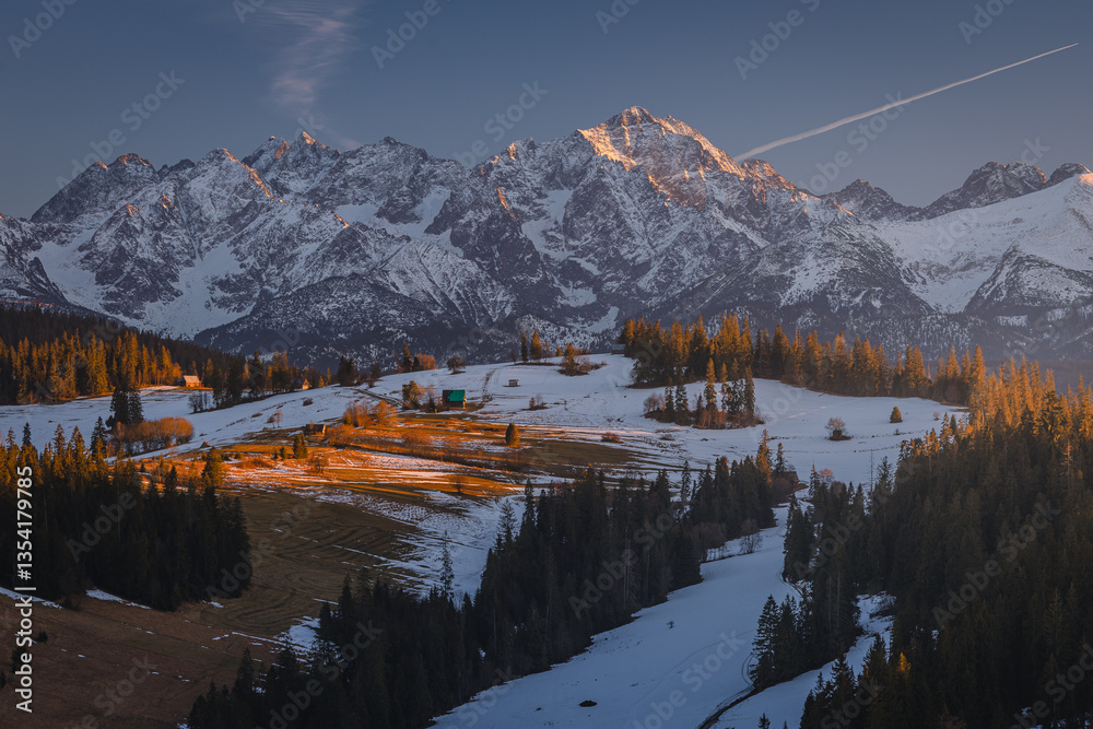 Views from Podhale towards the Tatra Mountains. This winter, there was less snow than usual, revealing more of the rugged landscape. A mix of winter and autumn colors creates a unique seasonal contras