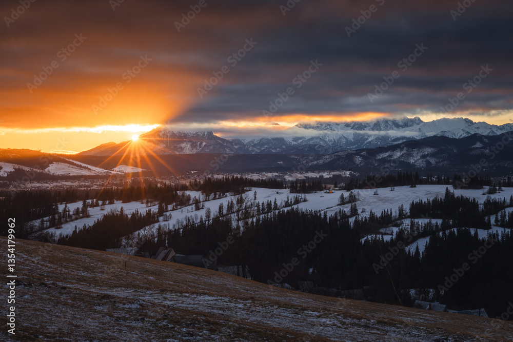 Views from Podhale towards the Tatra Mountains. This winter, there was less snow than usual, revealing more of the rugged landscape. A mix of winter and autumn colors creates a unique seasonal contras