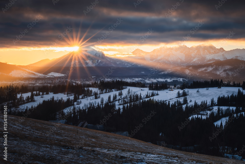 Views from Podhale towards the Tatra Mountains. This winter, there was less snow than usual, revealing more of the rugged landscape. A mix of winter and autumn colors creates a unique seasonal contras