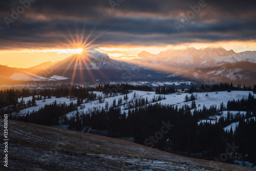 Obraz na płótnie Views from Podhale towards the Tatra Mountains. This winter, there was less snow than usual, revealing more of the rugged landscape. A mix of winter and autumn colors creates a unique seasonal contras w salonie
