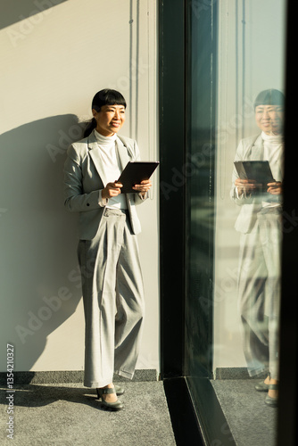 Professional Asian woman sm...