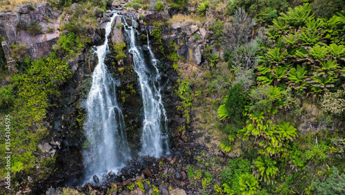 A waterfall and it´s nearby vegetation in Tasmania, seen from above