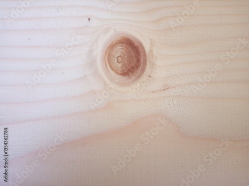 Close-up view of wooden board with a knot