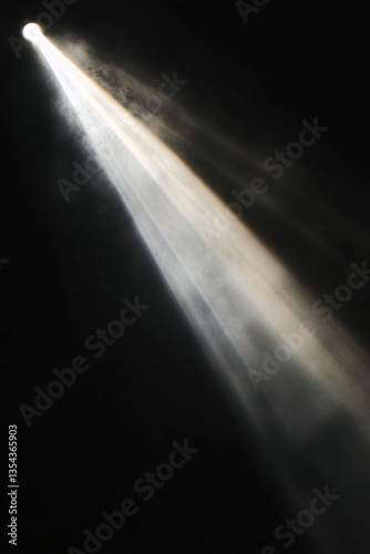 Sunbeam light rays in dark atmosphere with glowing streaks, diagonal sunlight effect and warm radiant textures for dramatic visual design, background lighting, or cinematic themes photo