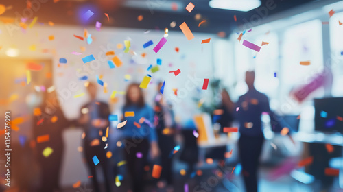 Colorful confetti falling in a modern office space during a company celebration, teamwork, and achievement concept.
