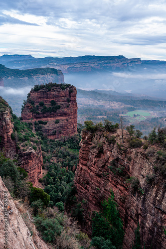 Grey morning at the edge of the cliffs (Sau Reservoir, Vilanova de Sau Spain) photo
