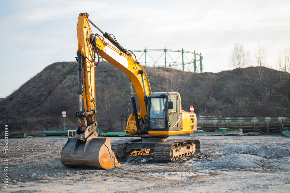 yellow bucket of a tractor for construction work in the ground yellow bucket of a tractor for construction work in the ground