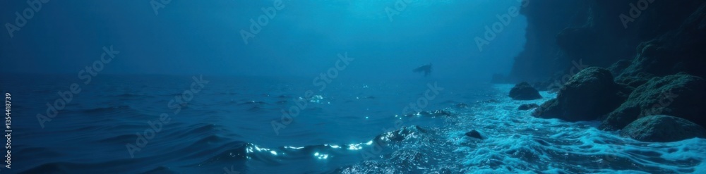 Fototapeta premium Diver's view of calm dark blue ocean surface with waves gently lapping at the edges, reflection, calm ocean, underwater view