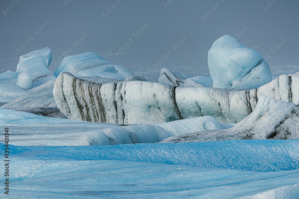 Glacial mountains in Iceland, showcasing rugged peaks and icy landscapes. A breathtaking view of nature's raw power, shaped by time and elements. Perfect for travel, adventure, and nature themes.