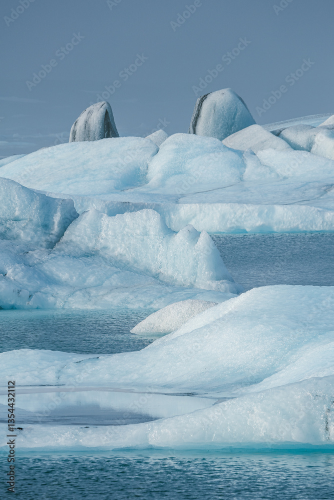 Glacial mountains in Iceland, showcasing rugged peaks and icy landscapes. A breathtaking view of nature's raw power, shaped by time and elements. Perfect for travel, adventure, and nature themes.
