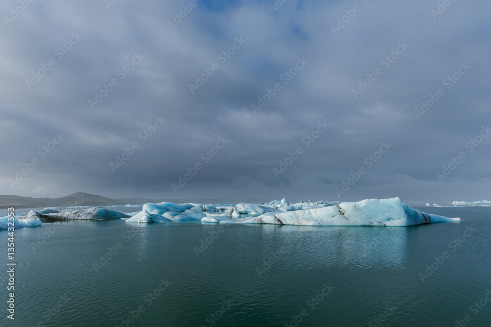 Seals resting on Icelandic ice floes, surrounded by the pristine Arctic landscape. A peaceful wildlife scene in the cold northern waters. Perfect for nature, wildlife, and travel themes.