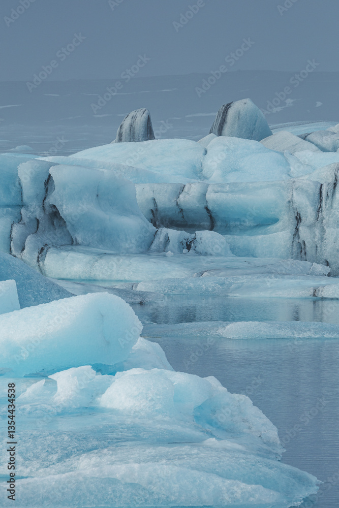 Glacial mountains in Iceland, showcasing rugged peaks and icy landscapes. A breathtaking view of nature's raw power, shaped by time and elements. Perfect for travel, adventure, and nature themes.