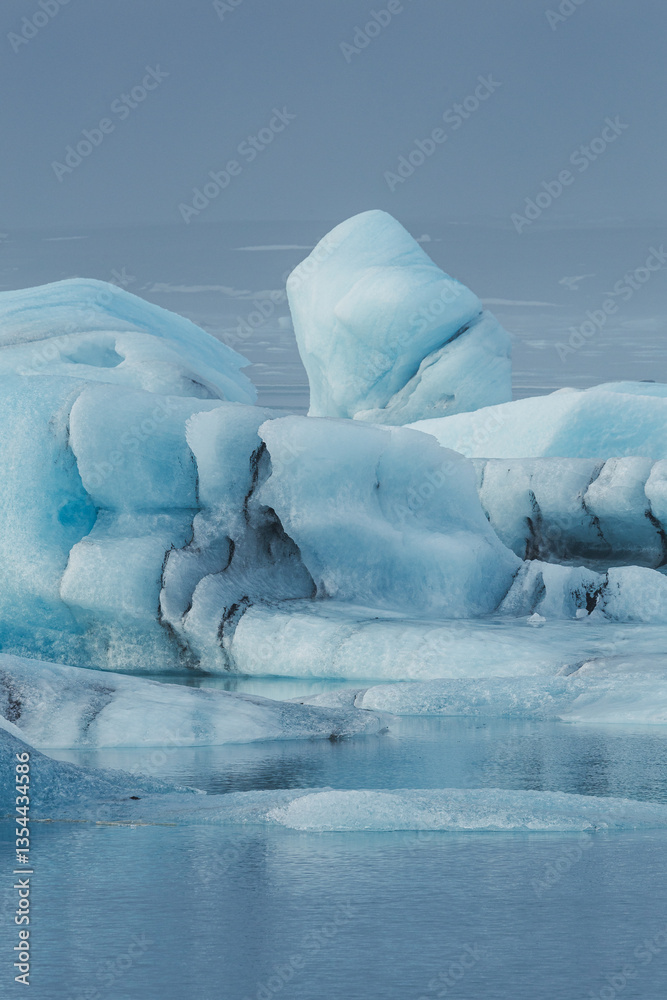 Glacial mountains in Iceland, showcasing rugged peaks and icy landscapes. A breathtaking view of nature's raw power, shaped by time and elements. Perfect for travel, adventure, and nature themes.