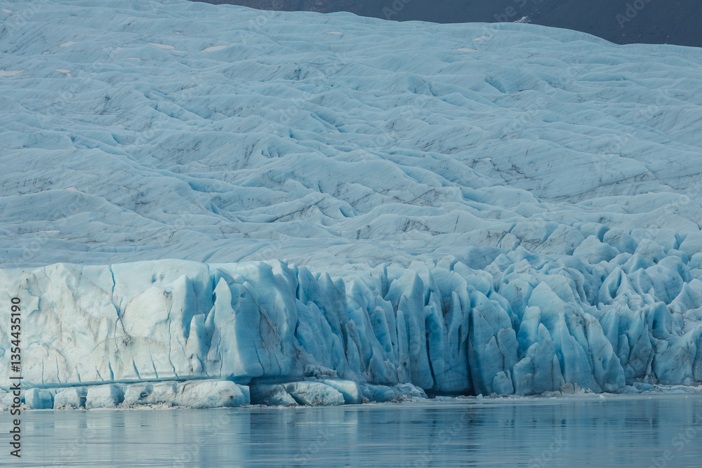 Glacial mountains in Iceland, showcasing rugged peaks and icy landscapes. A breathtaking view of nature's raw power, shaped by time and elements. Perfect for travel, adventure, and nature themes.