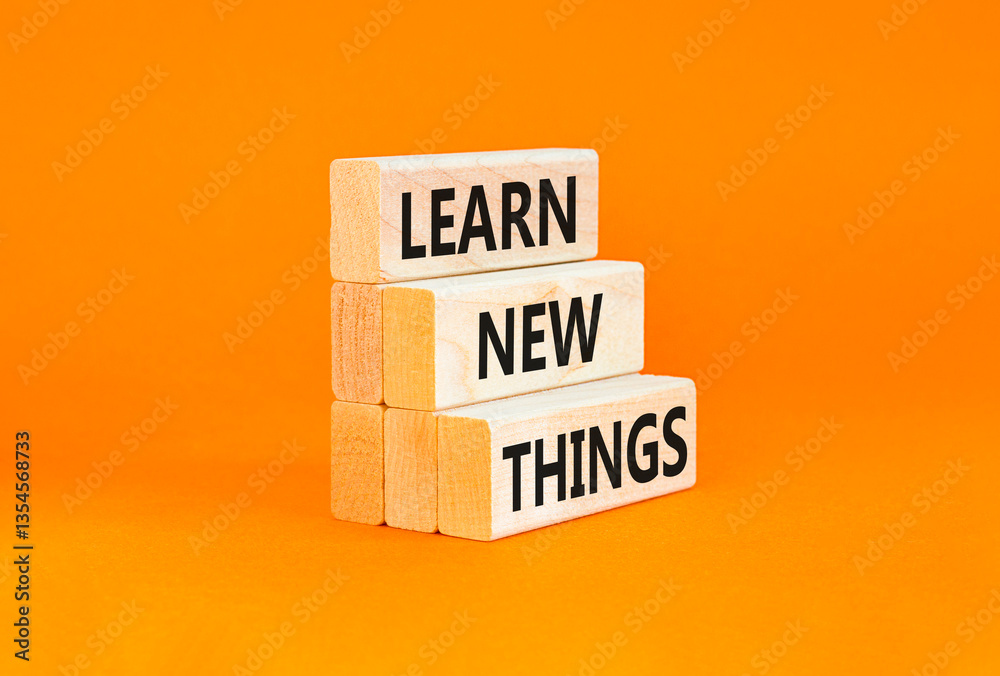 Naklejka premium Learn new things symbol. Concept words Learn new things on beautiful wooden blocks. Beautiful orange table orange background. Business motivational learn new things concept. Copy space.