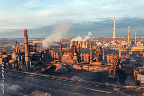 Smelter with blast furnaces from above during autumn morning. Heavy industry plant during sunrise.
