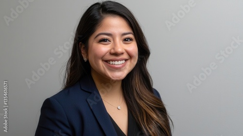 Portrait of a Smiling Young Woman in a Business Suit