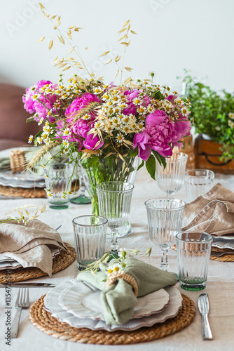 Shavuot table setting. Herbs table decorations for holidays and dinner