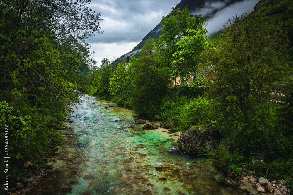 Beautiful Soca river in the fresh green forest, Bovec, Slovenia