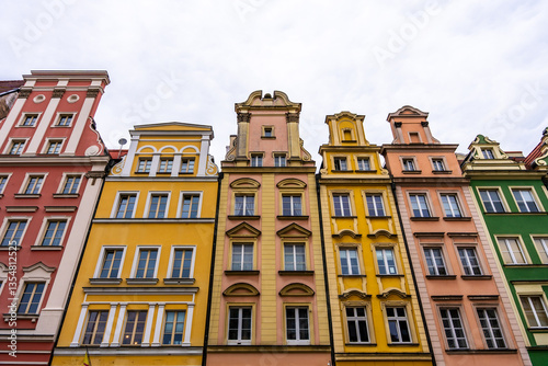 Colorful historic tenement houses in European old town, architectural heritage, tourism and culture