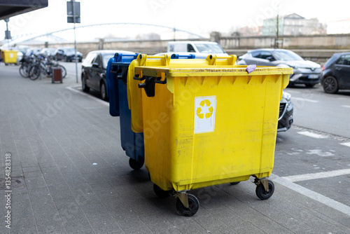 Obraz na płótnie Yellow and blue Recycling Bin for plastic Waste. Waste containers for garbage segregation in Poland. Environmental conservation saving planet from contamination w salonie