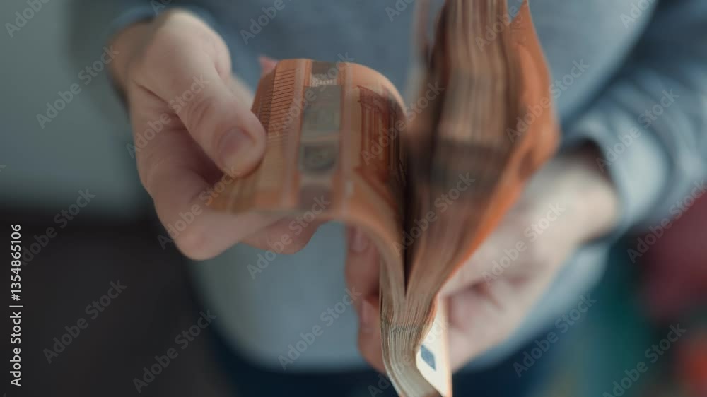 Hands showing euro banknotes, highlighting monetary success and prosperity.