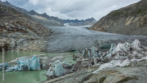 Timelapse, view of melting glacier in the Swiss Alps. Rhone Glacier, the source of the river Rhone. Furka Pass, Canton Valais, Switzerland