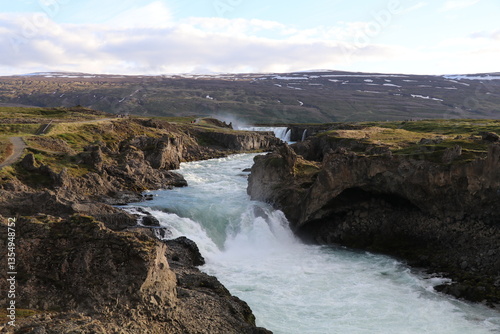 Godafoss waterfall in Iceland during golden hour on a sunny day