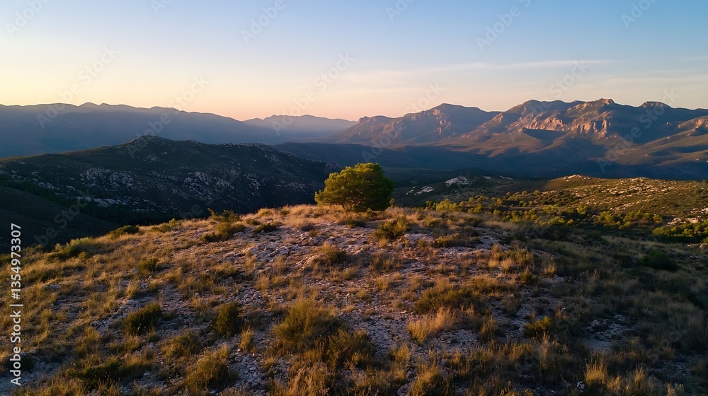 Fototapeta premium Stunning sunset view from a hilltop showcasing lone tree and rugged mountain landscape : Generative AI