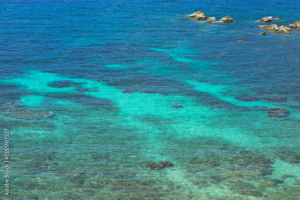 Obraz premium Seascape with transparent azure water, underwater stones and blue sky. Thailand. Andaman Sea