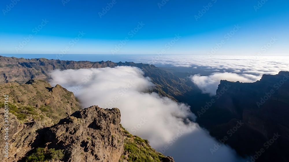 Fototapeta premium Stunning panoramic view of majestic mountains and clouds from a high altitude against a clear blue sky : Generative AI