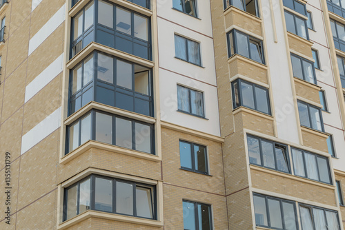 Facade of a modern residential building. New building in the city. high building for business