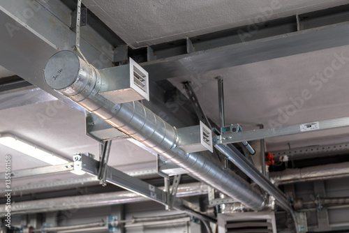Air heating system for industrial premises, new technologies. Ventilation pipes on the ceiling