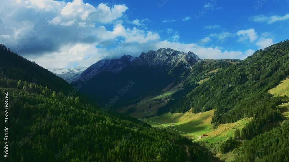 A lush green valley between towering mountains under a bright blue sky, showcasing the beauty of untouched nature. A lush green valley between towering mountains under a bright blue sky, showcasing the beauty of untouched nature.