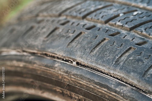 Obraz na płótnie Old car tire with surface wear and tear w salonie